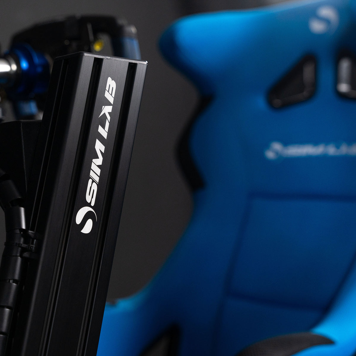 Close-up of the GT1 Pro sim racing cockpit uprights with Sim-Lab logo.