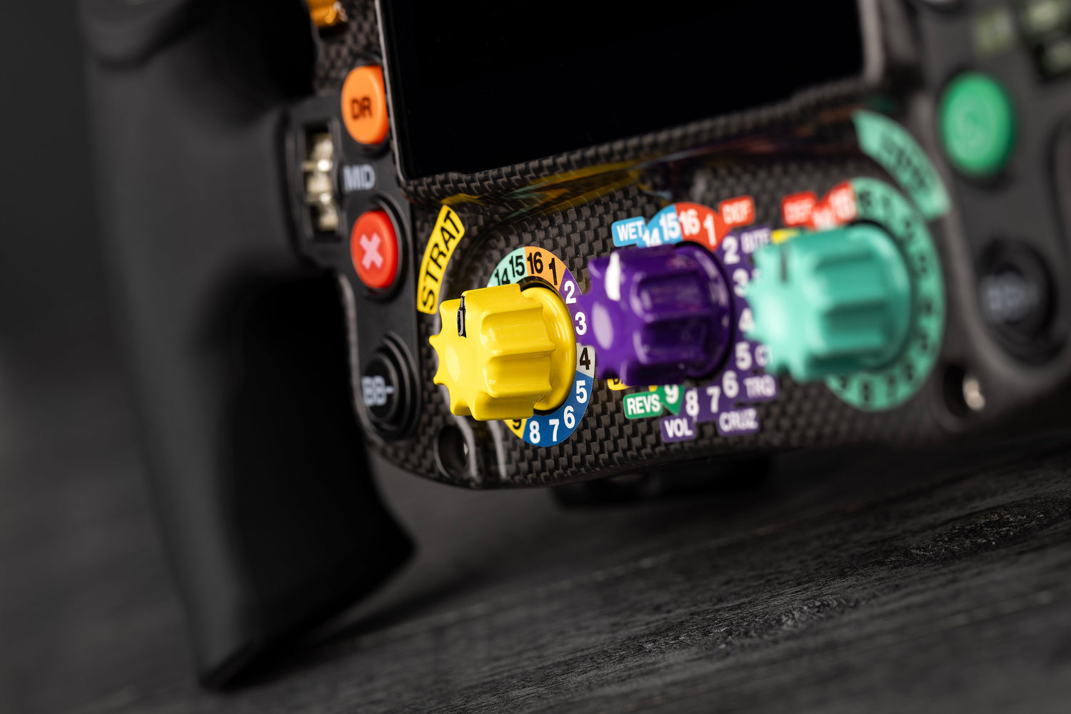 Three rotary switches at the bottom of the Mercedes-AMG PETRONAS Formula One Team Sim Racing Steering Wheel (2024)